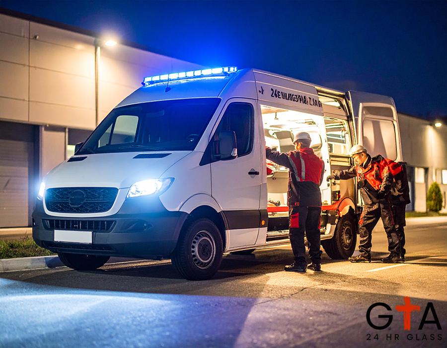 Firefly_A service van with “24-7 Emergency Glass Repair” branding, parked outside a building 85449