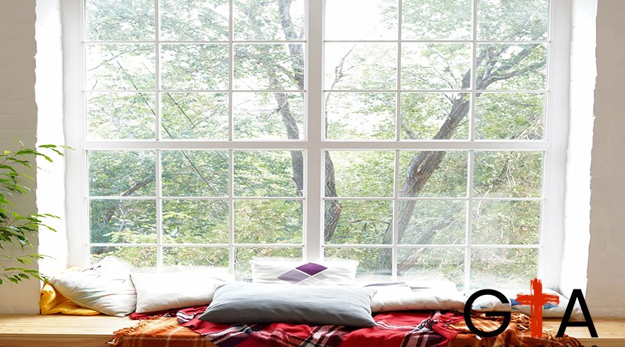 autumn window landscape with with plaid and pillows, comfort home