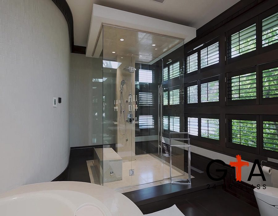 bathroom-with-glass-wall-that-has-windows-that-say-spa