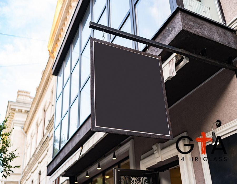 Blank mock up design of cafe signboard on nice building outdoors