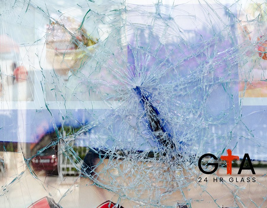 Cracked and broken glass window of a car