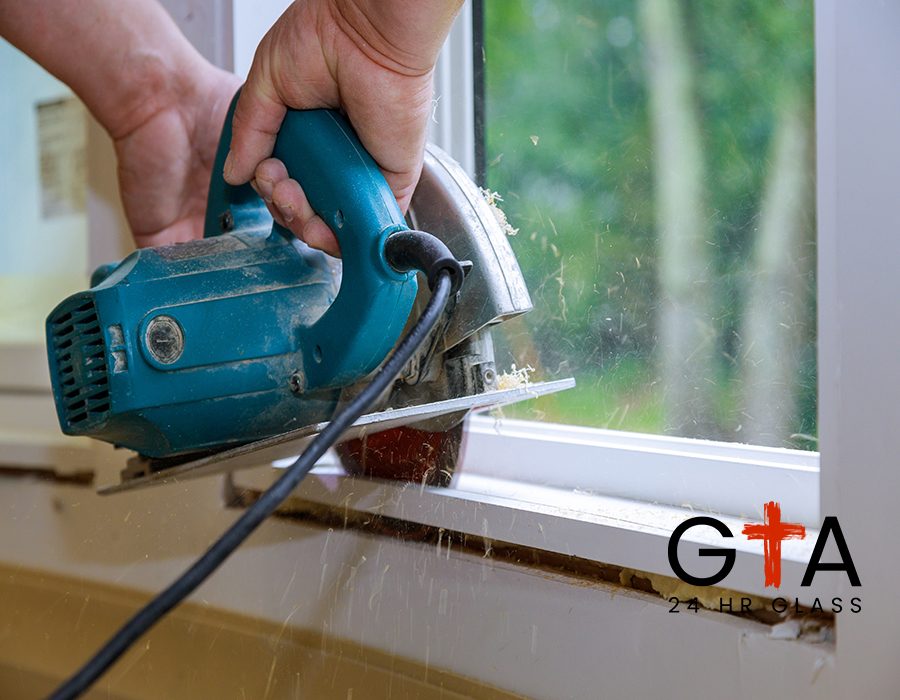 Carpenter using hands cutting wood with electric saw