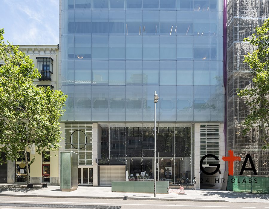 Glass facade of a commercial and office building Glass facade of a commercial and office building