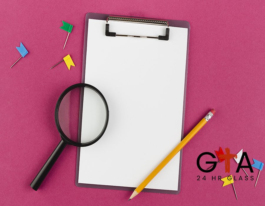 top-view-desk-with-notepad-magnifying-glass