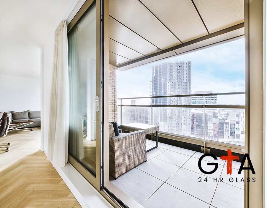 Cozy sofa and wooden table placed on balcony of apartment building with cityscape view